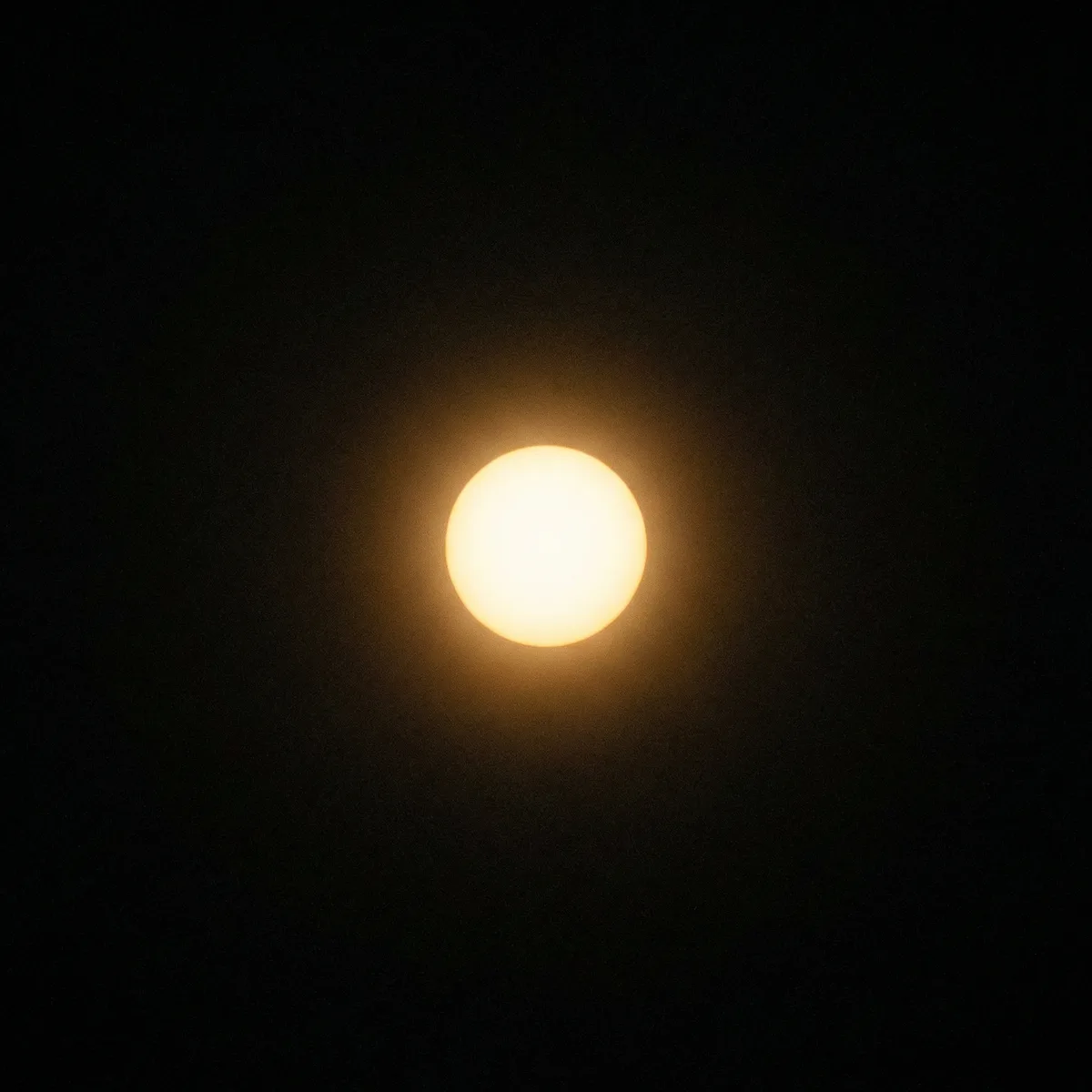 Single luminous point of consciousness in vast darkness