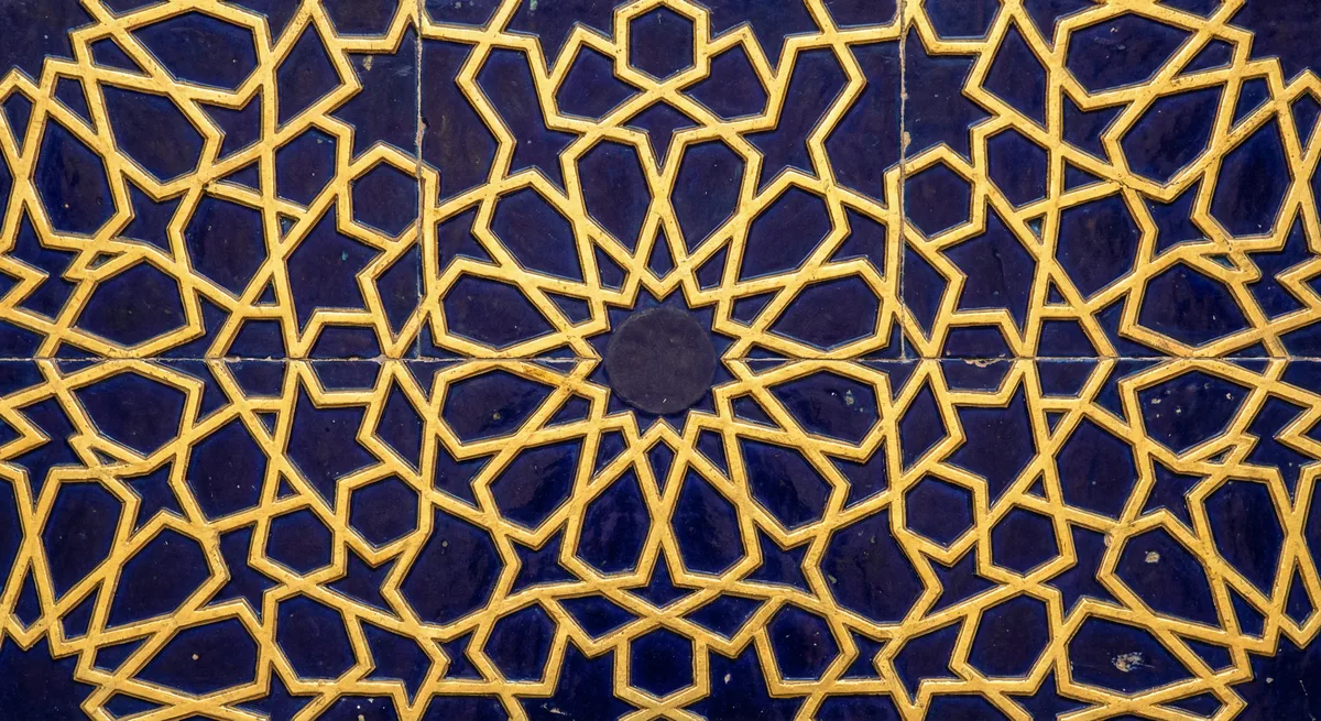 Abstract geometric pattern suggesting divine oneness — Islamic geometric design, gold on deep blue